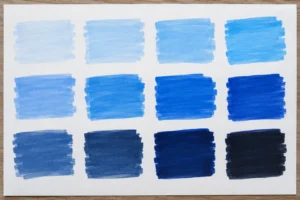 Blue brush-ink colour swatches on white paper