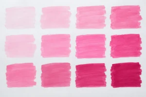 Rosa Pinsel-Tinten-Farbmuster auf weißem Papier