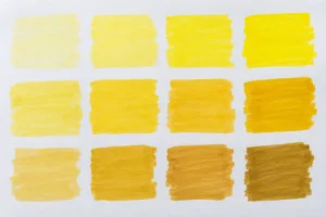 Yellow brush-ink colour swatches on white paper