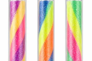 Close-up of multicolour glitter ink columns inside transparent gel pen barrels